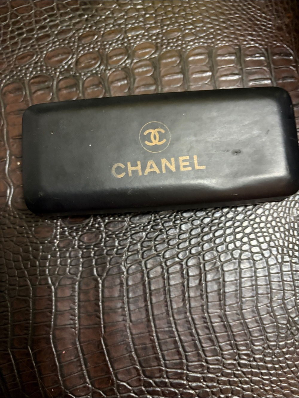 CHANEL Black Case with Gold Logo